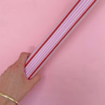 roll of red and pink stripy gift wrap