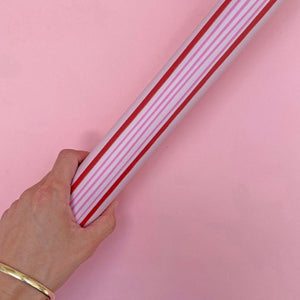 roll of red and pink stripy gift wrap