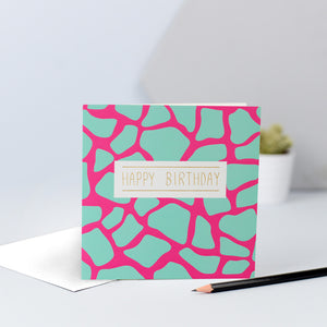 A fun green and pink giraffe print birthday card.