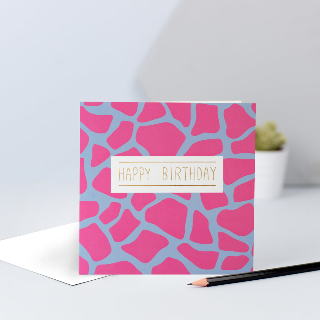 A pink and lilac giraffe print birthday card.