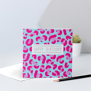 A pink and blue leopard print card