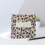 A yellow, lilac and navy leopard print birthday card