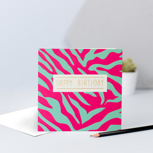 A pink and green zebra print birthday card.
