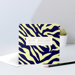 A yellow and navy zebra print birthday card