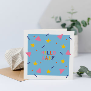 A unisex new baby card with the words hello baby