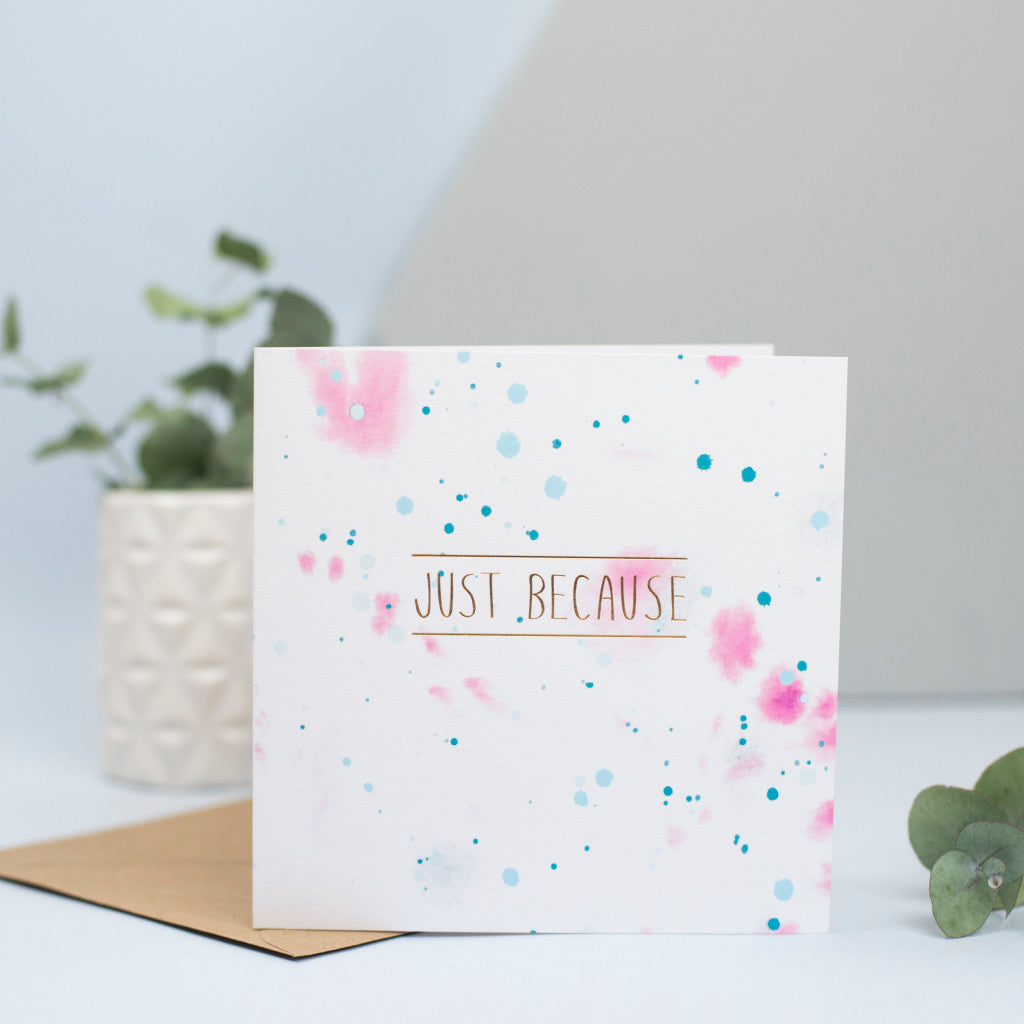 A gorgeous card for any occasion with a pink and blue watercolour background and foiled words "Just because" in the foreground.
