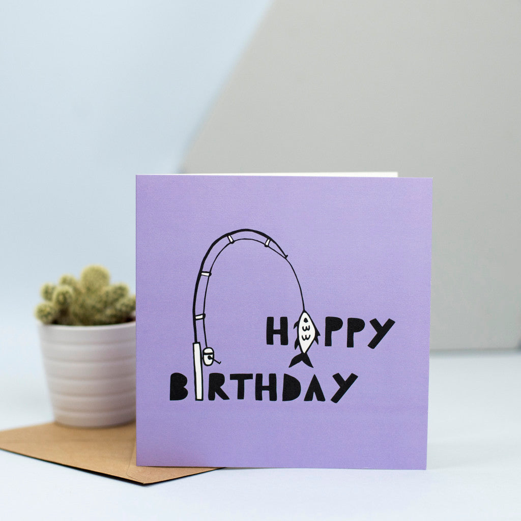 A fun birthday card with the words Happy Birthday and a fishing rod incorporated within the design.