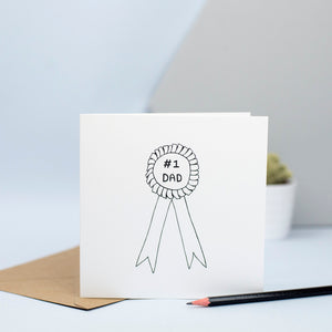 A simple illustration of a rosette with the words #1 Dad.  The perfect card for fathers day or your dad's birthday.  