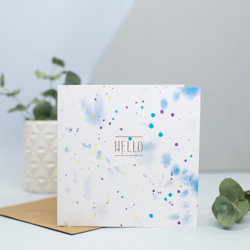 A watercolour design with the word hello