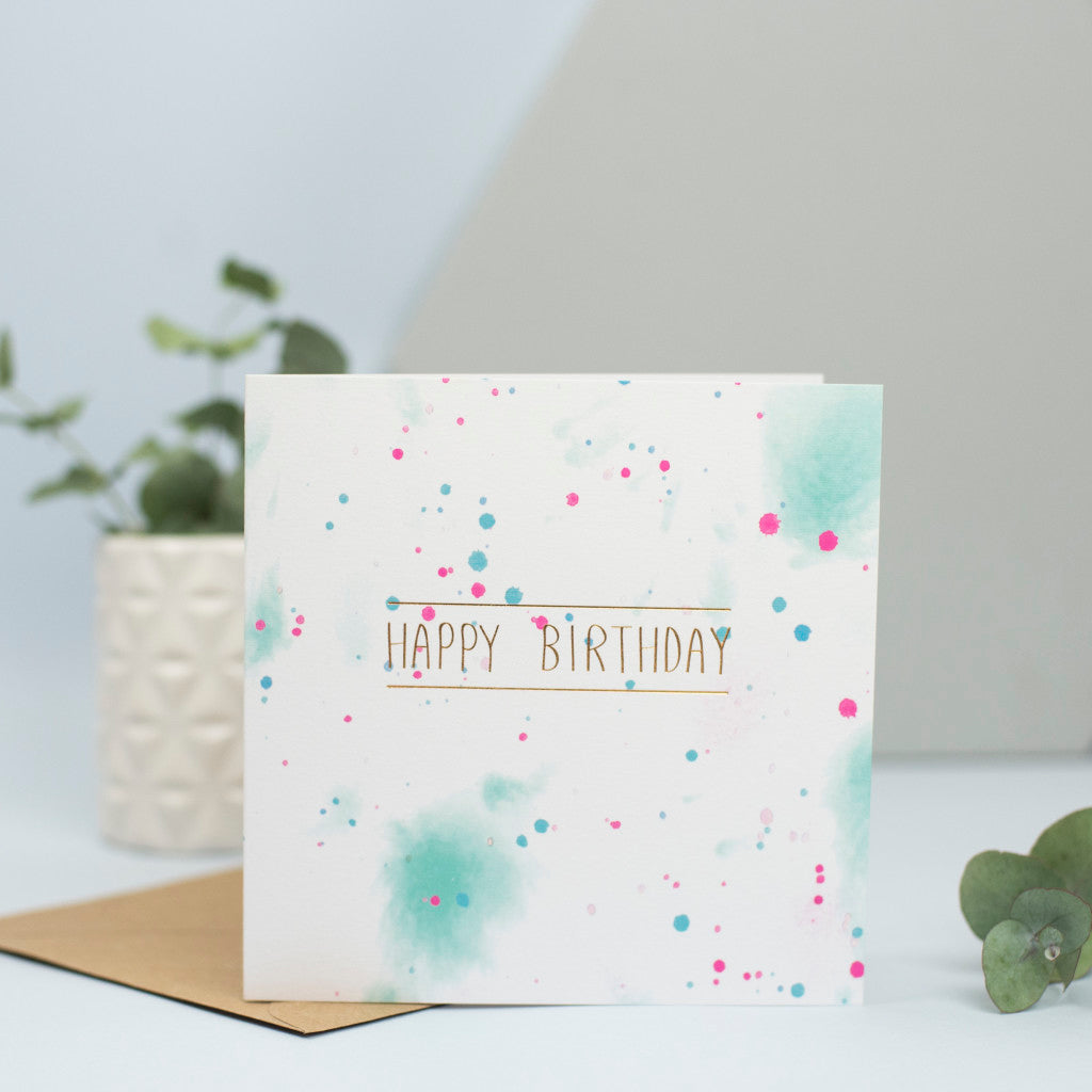A beautiful birthday card for any age with a watercolour background and the words "Happy birthday" in gold foil.