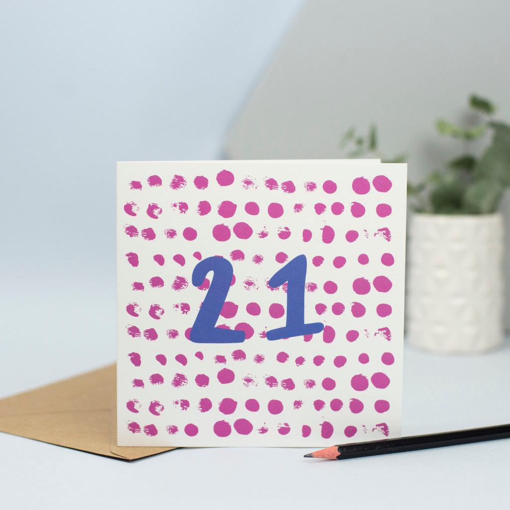 A fun, simple design for a 21st birthday. This design was made using mark making with maroon circular dots in the background and the umber 21 in blue in the foreground.