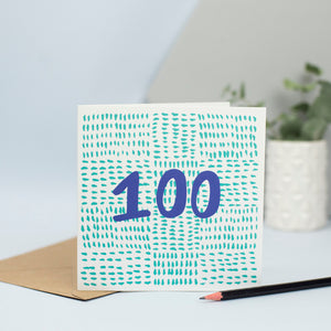 A contemporary birthday card for someone turning 100 created using mark making. A background made up of small green marks with the number 100 in the foreground in blue.