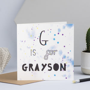 A close up of the blue design with the words G is for Grayson