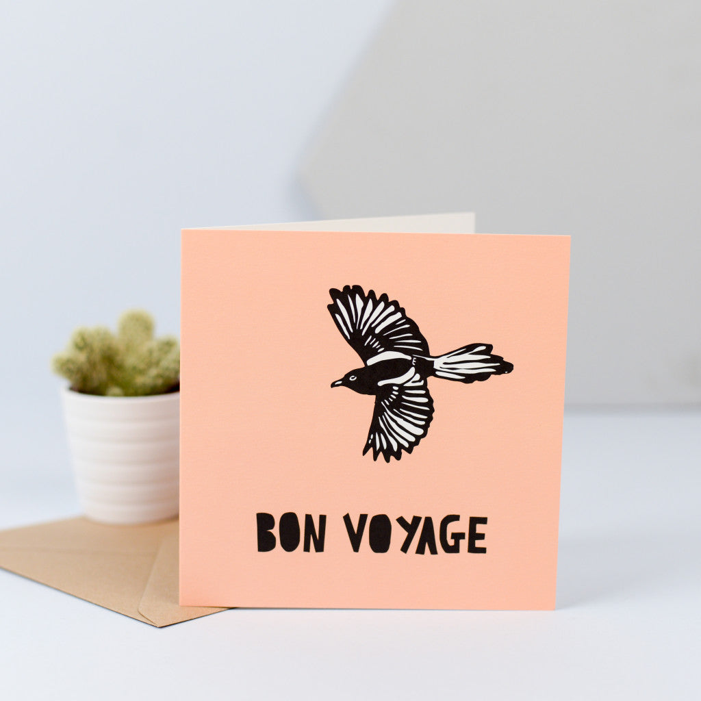 A leaving card with a design of a bird in flight. 