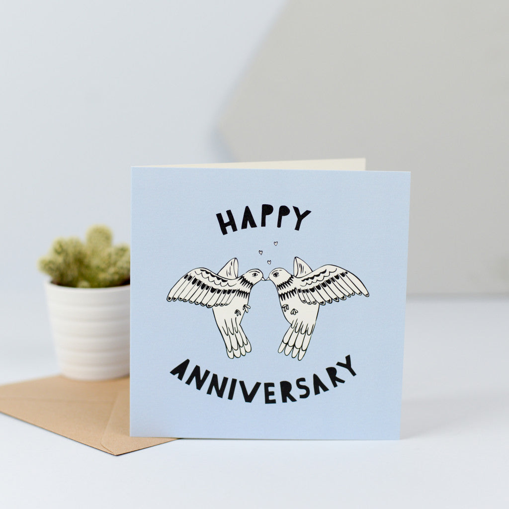 A lovely anniversary card with an illustration of two doves sharing a kiss.