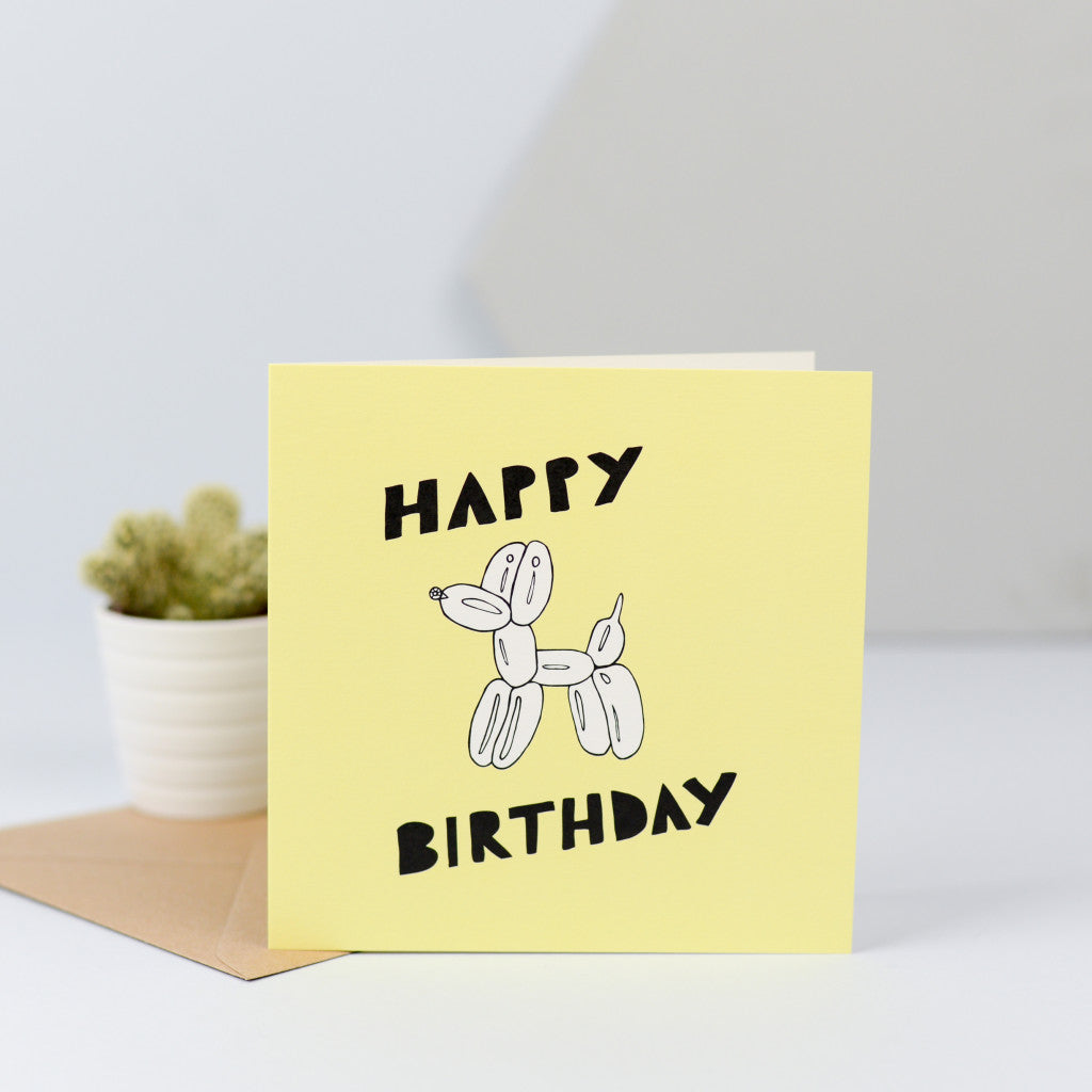 A fun birthday card with an illustration of a balloon dog.