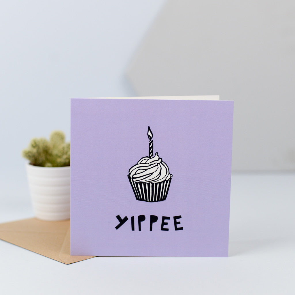 An illustration of a cupcake with a single candle