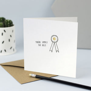 Hand drawn illustration of a rosette with gold foil and the words "You're simply the best"