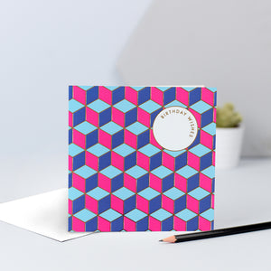 A pink and blue tessellating birthday wishes card