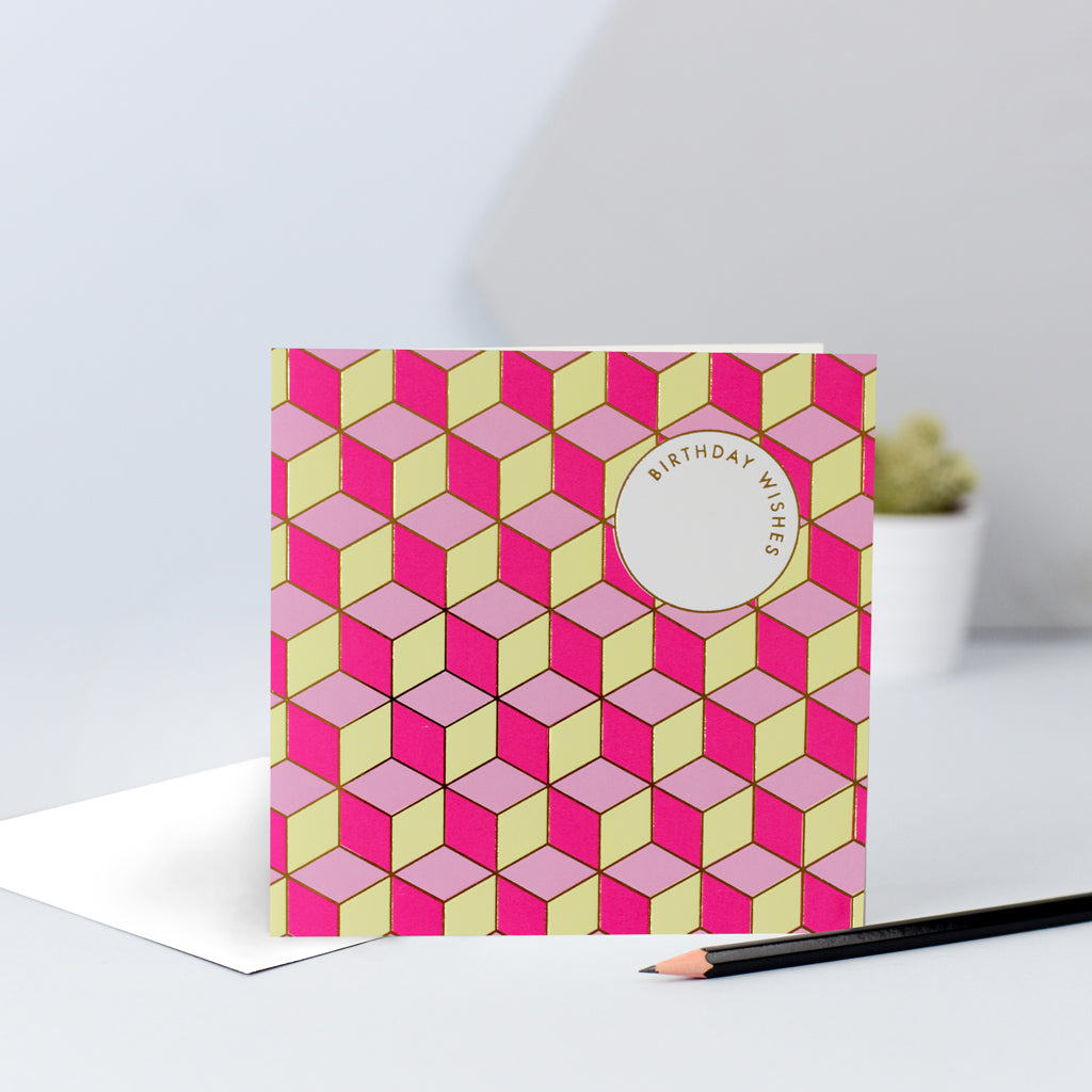 A fun tessellating pattern with pinks and yellows, finished with gold foil and the words "Birthday Wishes".