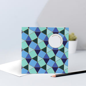 A blue and green tessellating birthday card with gold foil