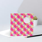 A lilac, yellow, orange & pink tessellating birthday card with a gold foil finish.