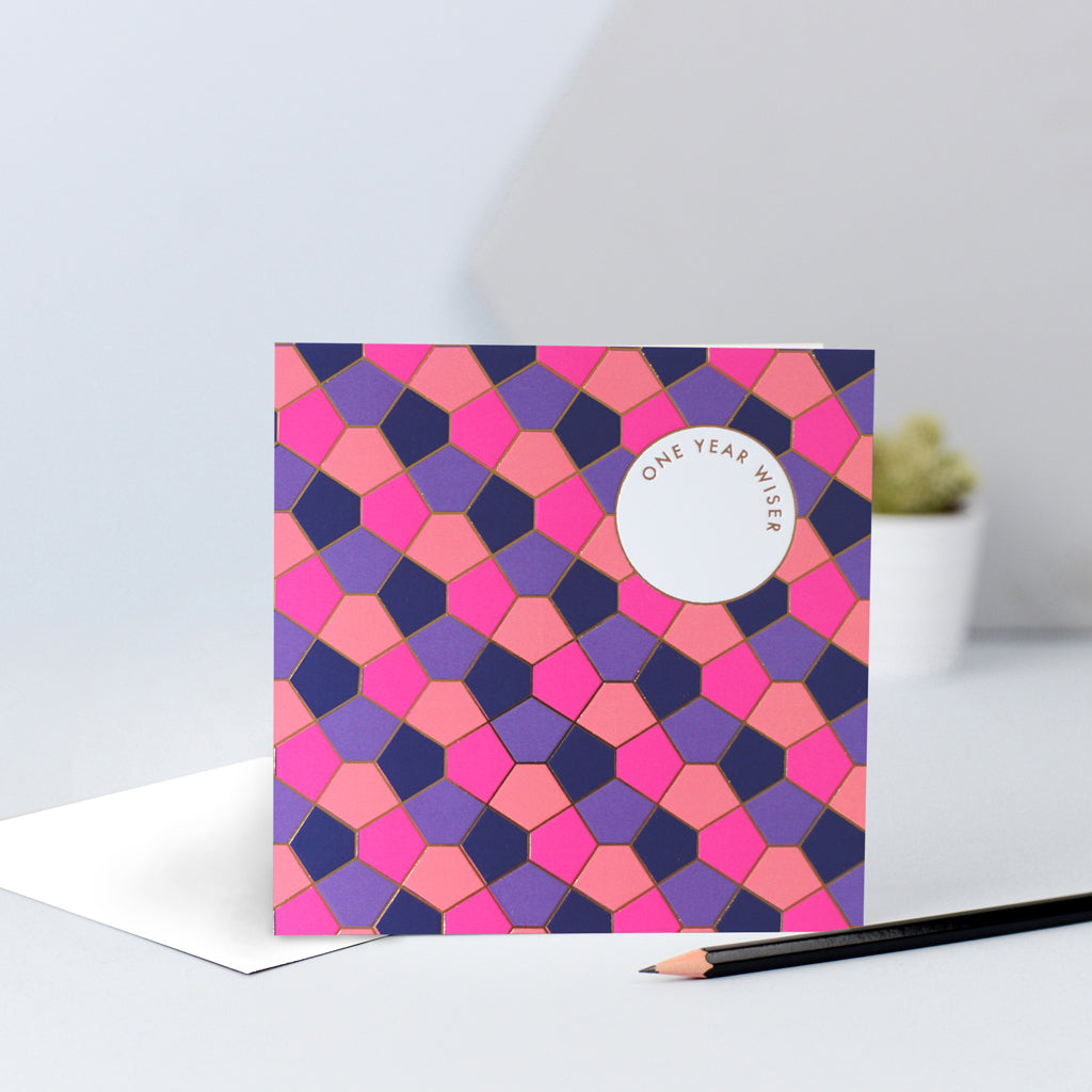 A purple, orange, navy & pink tessellating birthday card design