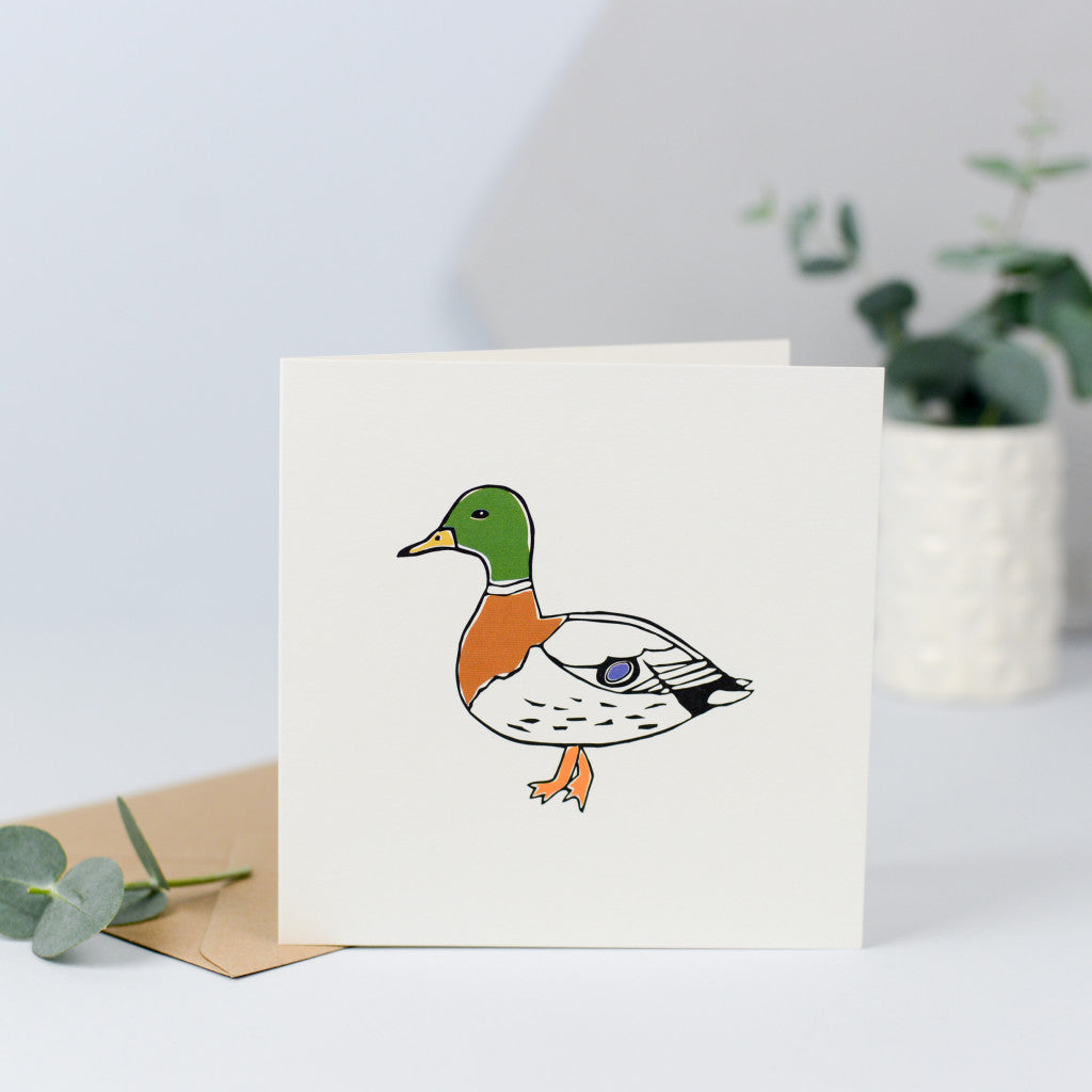 A card with an illustration of a duck.