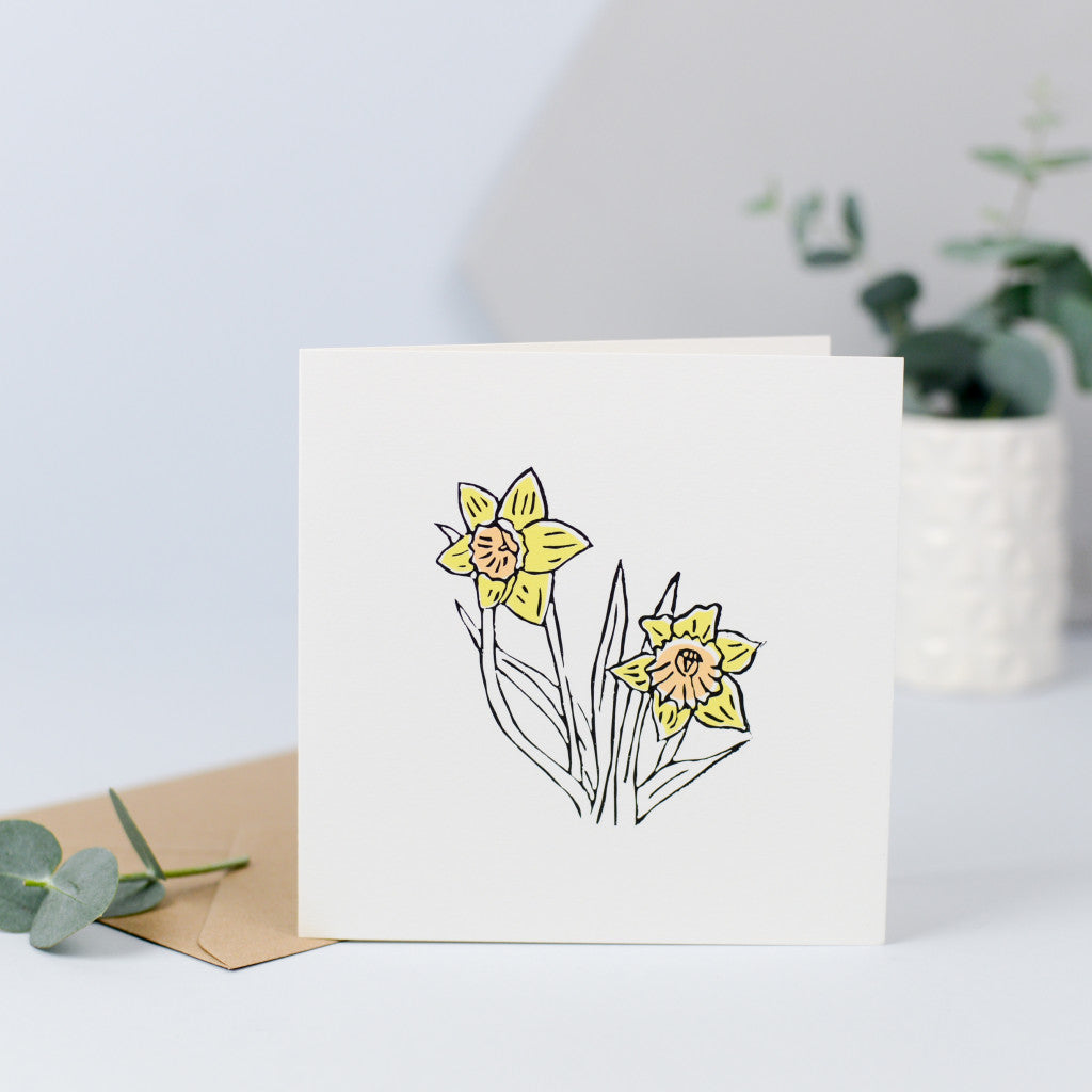A daffodil illustration originally hand carved in rubber and hand printed.